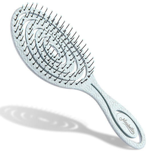 Ninabella detangling Hairbrush with packaging and color options displayed